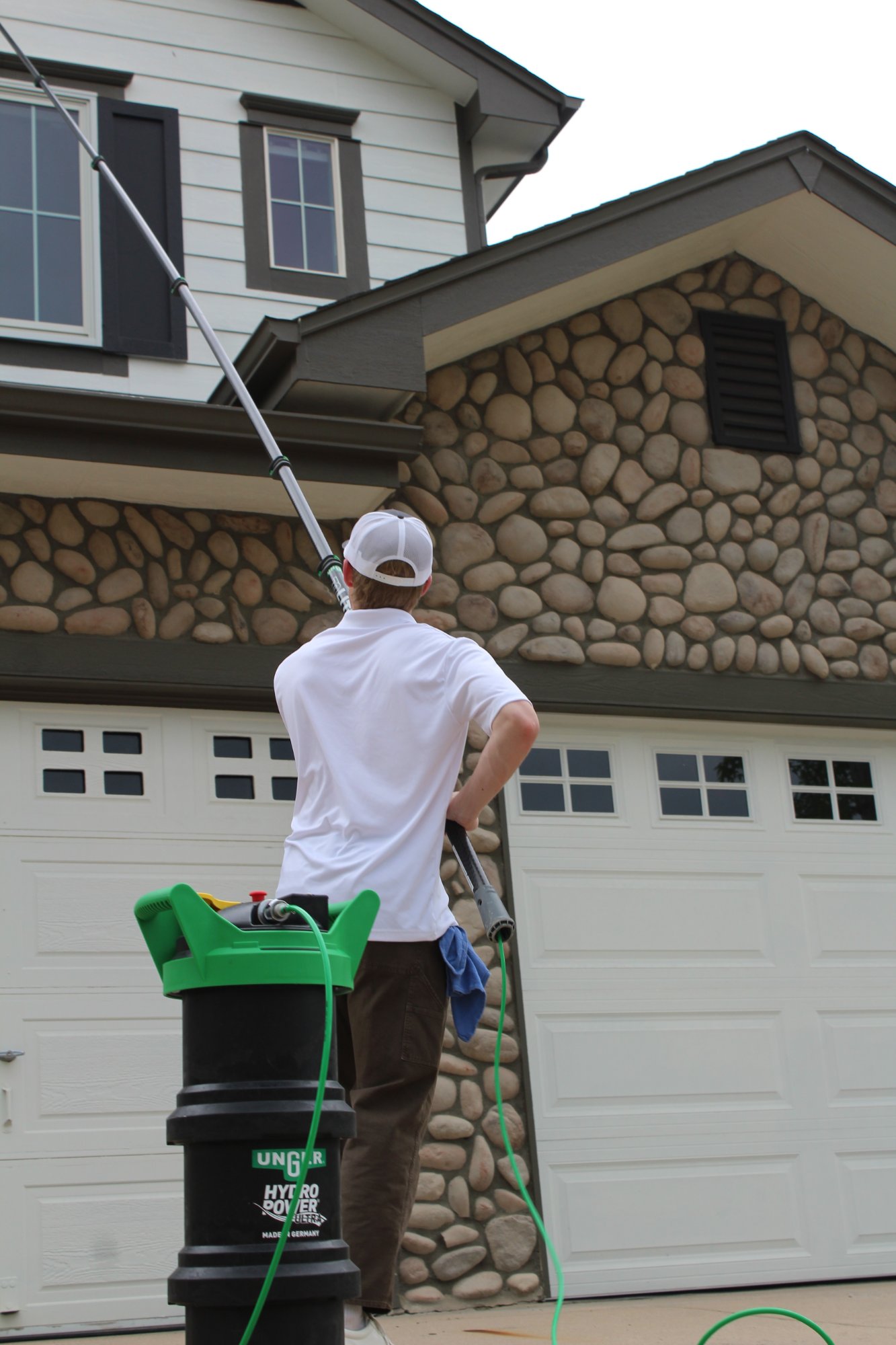 Rocky Mountain Shine cleaning windows on a Colorado home